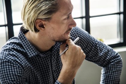 male-thinking-in-office