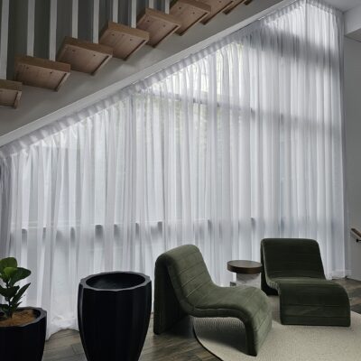 Angled_Sheer_curtains_under_stairs