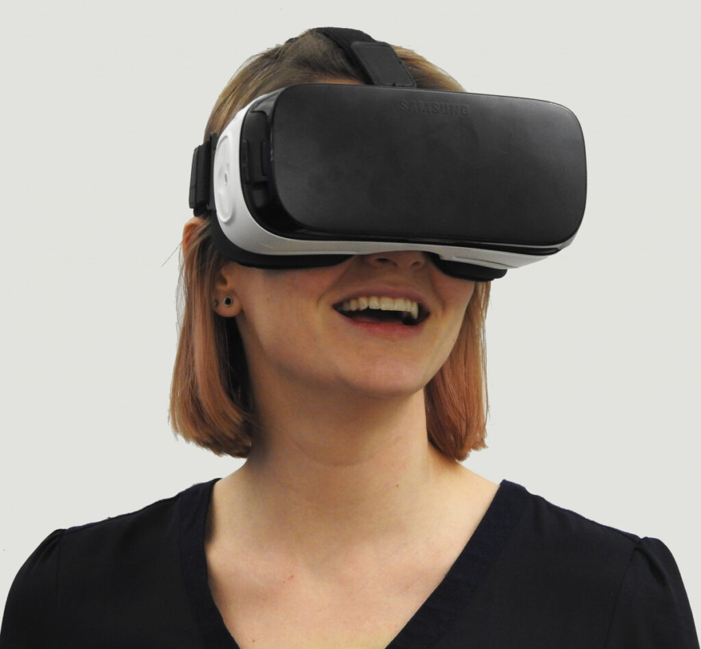 Woman looking through a virtual reality headset